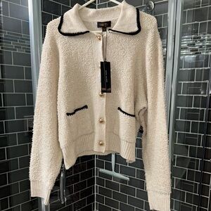 Cream Textured Sweater with Black Trim NWT.